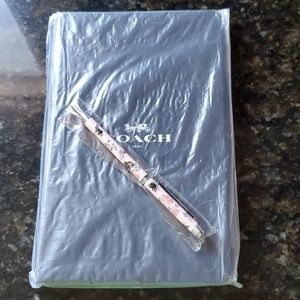 Coach notebook and pen